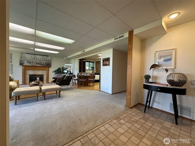 714 SW 296th St, Federal Way, WA 98023 - carpeted living room with baseboards, a glass covered fireplace, and a drop ceiling