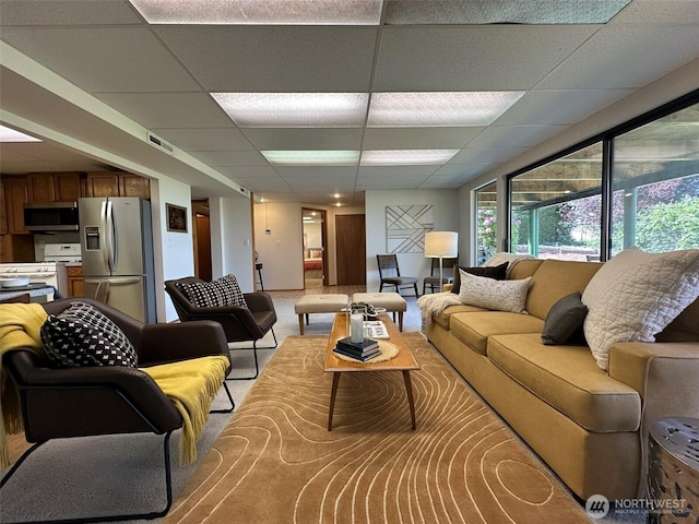 714 SW 296th St, Federal Way, WA 98023 - living room featuring a paneled ceiling and light carpet
