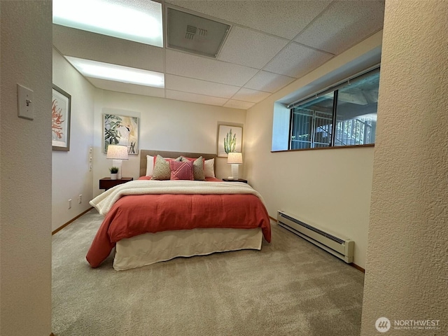 714 SW 296th St, Federal Way, WA 98023 - bedroom with a baseboard heating unit, carpet floors, and a paneled ceiling