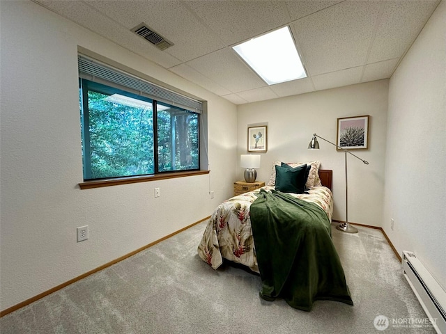 714 SW 296th St, Federal Way, WA 98023 - carpeted bedroom featuring a baseboard radiator, baseboards, and a paneled ceiling