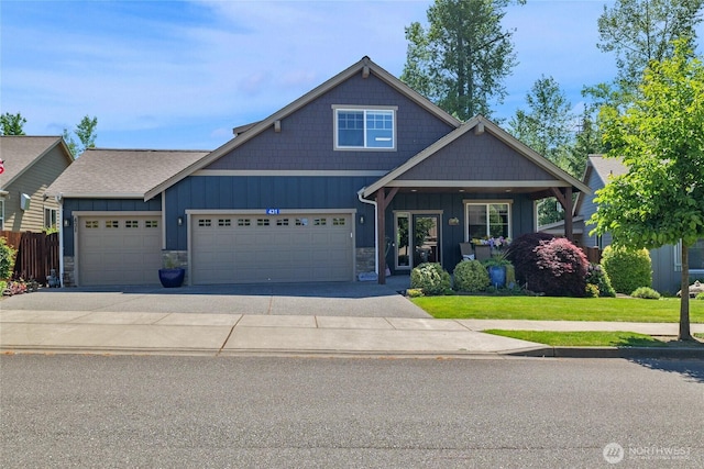 431 Timberland Loop, Mount Vernon, WA 98273 - craftsman house featuring board and batten siding, a garage, stone siding, and concrete driveway