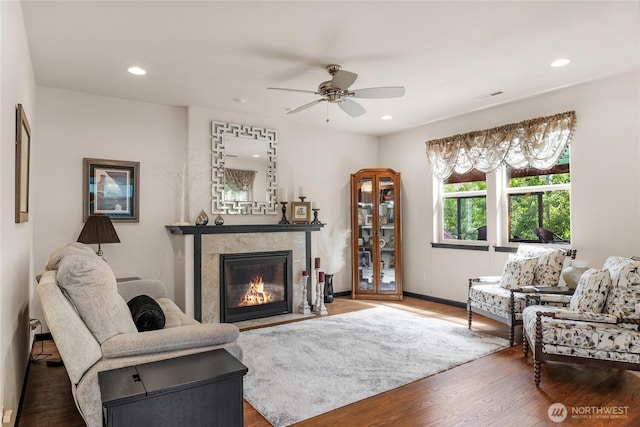431 Timberland Loop, Mount Vernon, WA 98273 - living area with a tiled fireplace, a ceiling fan, wood finished floors, recessed lighting, and baseboards