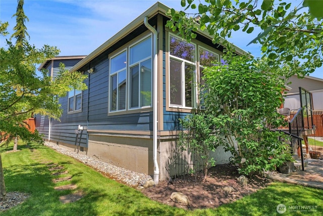 431 Timberland Loop, Mount Vernon, WA 98273 - view of home's exterior featuring a lawn