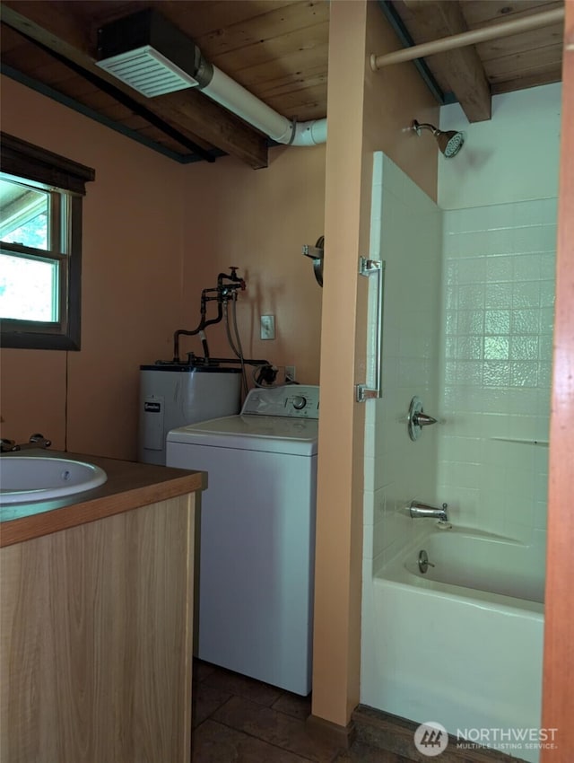 12508 Kellogg Lake Rd, Sultan, WA 98294 - bathroom with washer / dryer, vanity, shower / bath combination, a wooden ceiling with exposed beams, and water heater