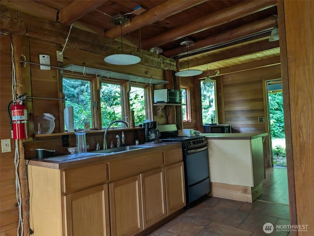 12508 Kellogg Lake Rd, Sultan, WA 98294 - kitchen featuring electric range oven, a wooden ceiling with exposed beams, stainless steel microwave, wooden walls, and dark stone finish floors