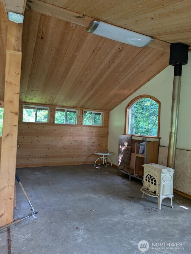 12508 Kellogg Lake Rd, Sultan, WA 98294 - misc room featuring a wood stove, healthy amount of natural light, vaulted ceiling, wood ceiling, and wood walls