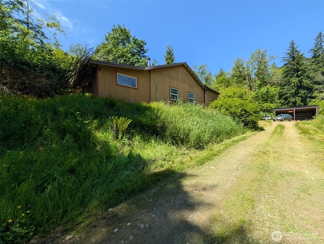 12508 Kellogg Lake Rd, Sultan, WA 98294 - view of home's exterior with driveway and a detached carport