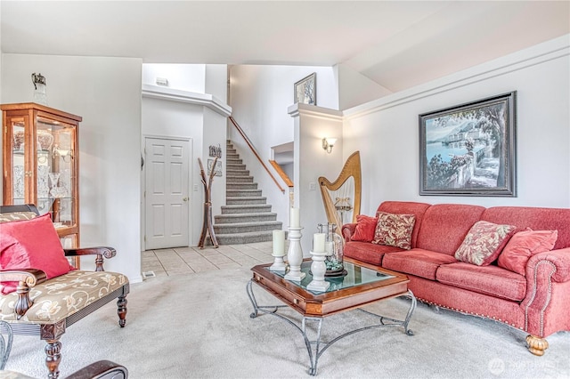 1649 Denise Cir, Wenatchee, WA 98801 - carpeted living area featuring stairs, tile patterned flooring, lofted ceiling, and baseboards
