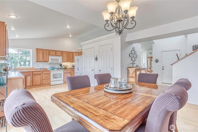 1649 Denise Cir, Wenatchee, WA 98801 - dining room featuring lofted ceiling, a chandelier, light wood-style flooring, and recessed lighting