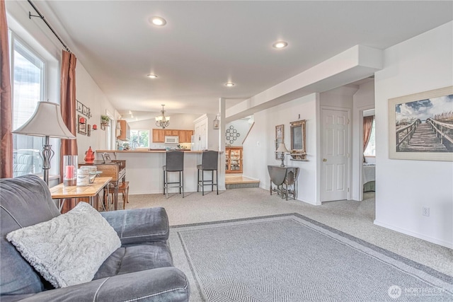 1649 Denise Cir, Wenatchee, WA 98801 - living room with a chandelier, baseboards, light carpet, and recessed lighting