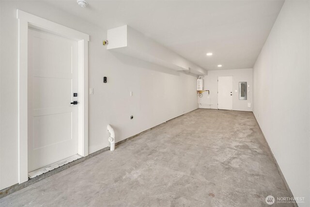 19722 Filbert Dr Unit B-3, Bothell, WA 98012 - unfurnished living room featuring electric panel, unfinished concrete floors, water heater, and recessed lighting