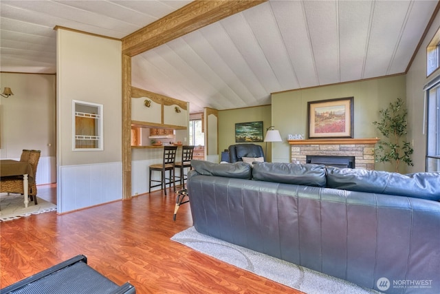 1851 Washington Dr, Point Roberts, WA 98281 - living area featuring a stone fireplace, wood finished floors, and a wainscoted wall