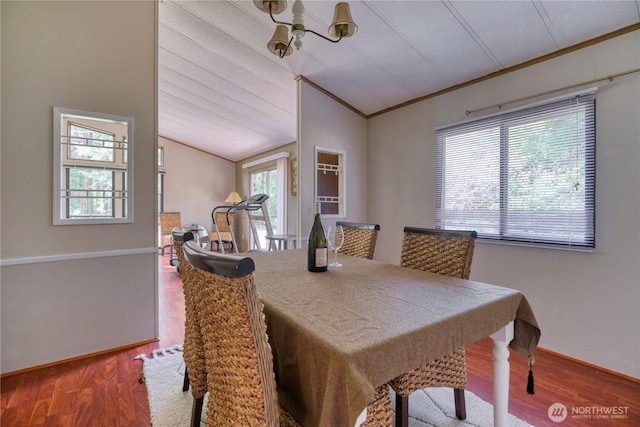 1851 Washington Dr, Point Roberts, WA 98281 - dining space featuring ornamental molding, vaulted ceiling, wood finished floors, a chandelier, and baseboards
