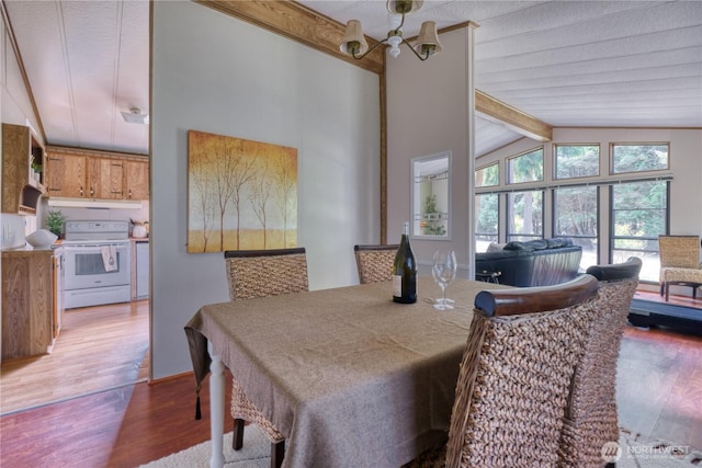 1851 Washington Dr, Point Roberts, WA 98281 - dining room featuring wood finished floors, beam ceiling, a chandelier, and high vaulted ceiling