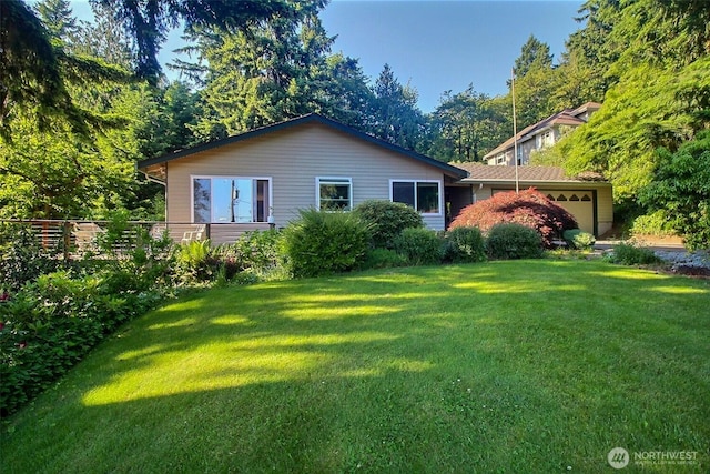 19640 SE 29th St, Sammamish, WA 98075 - rear view of property featuring a garage and a lawn