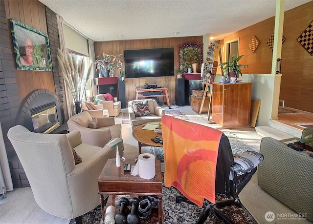 19640 SE 29th St, Sammamish, WA 98075 - carpeted living room with wood walls, a fireplace, and a textured ceiling