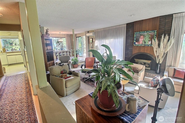 19640 SE 29th St, Sammamish, WA 98075 - living area featuring a wall mounted air conditioner, a textured ceiling, and a fireplace