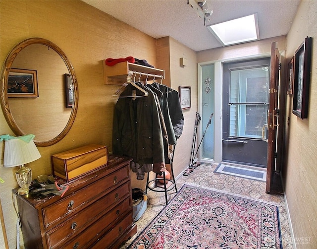 19640 SE 29th St, Sammamish, WA 98075 - foyer with light flooring, a textured wall, and a skylight