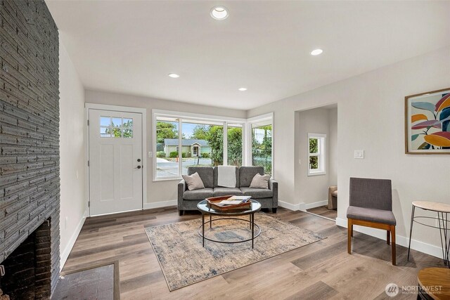 8206 N Way SW, Lakewood, WA 98498 - living room with baseboards, wood finished floors, recessed lighting, and a fireplace with flush hearth