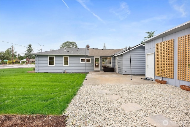 8206 N Way SW, Lakewood, WA 98498 - back of house featuring a patio area and a lawn