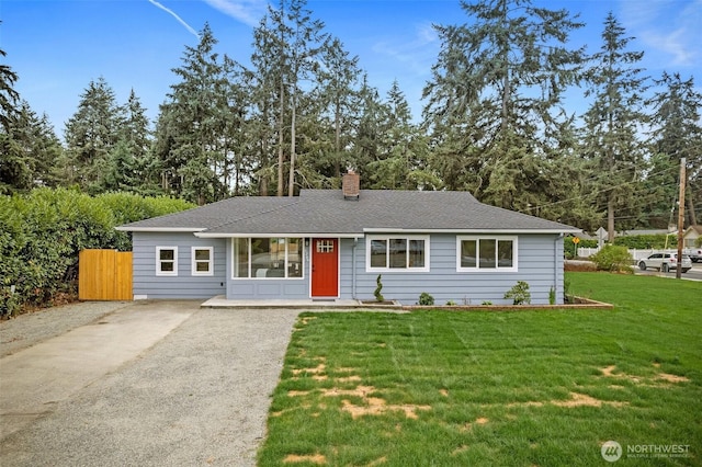 8206 N Way SW, Lakewood, WA 98498 - view of front of house with a chimney, driveway, and roof with shingles