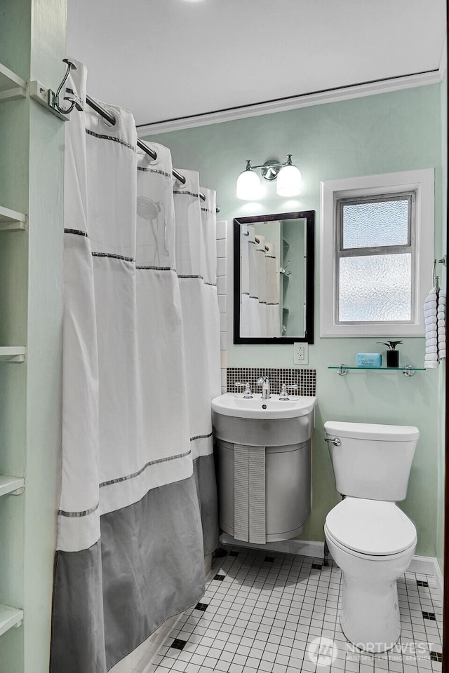 5521 34th Ave NE, Seattle, WA 98105 - bathroom with toilet, tile patterned floors, a shower with curtain, and a sink