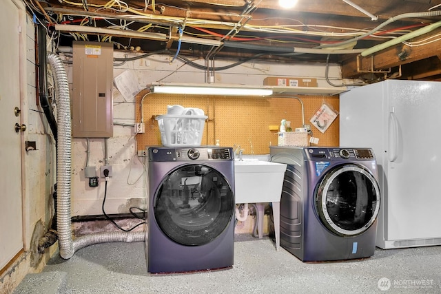 5521 34th Ave NE, Seattle, WA 98105 - laundry room featuring electric panel and separate washer and dryer