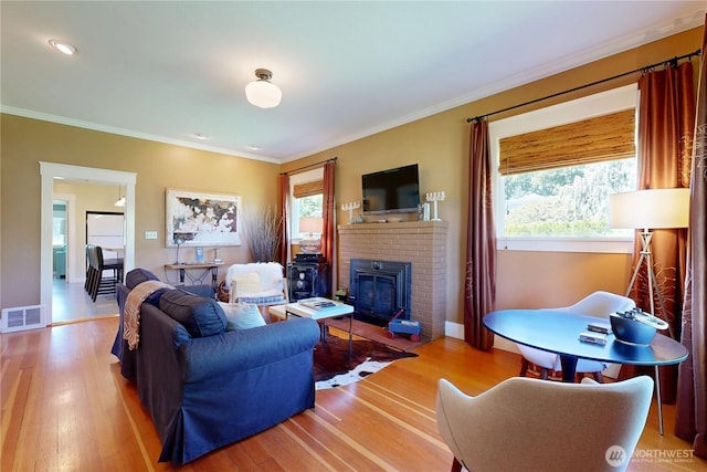 1250 Bryant, Walla Walla, WA 99362 - living area featuring wood finished floors, a brick fireplace, crown molding, and baseboards