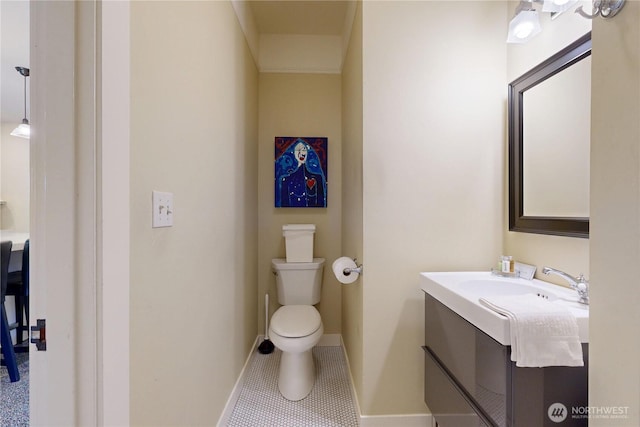 1250 Bryant, Walla Walla, WA 99362 - bathroom featuring toilet, vanity, tile patterned flooring, and baseboards