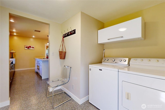 1250 Bryant, Walla Walla, WA 99362 - laundry area featuring washer and clothes dryer, baseboards, and cabinet space