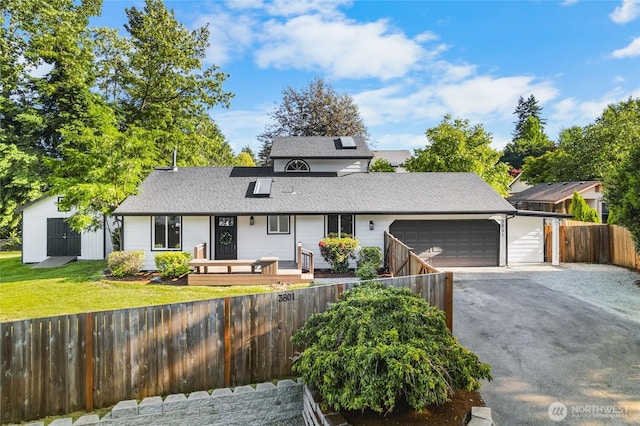 3801 Ruddell Rd SE, Lacey, WA 98503 - traditional-style home with a garage, driveway, and roof with shingles