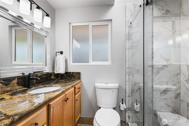 3801 Ruddell Rd SE, Lacey, WA 98503 - full bath featuring toilet, vanity, and a stall shower