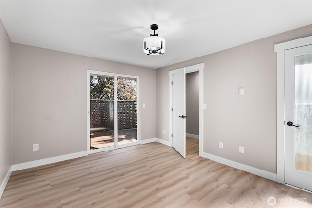 3801 Ruddell Rd SE, Lacey, WA 98503 - unfurnished room featuring healthy amount of natural light, wood finished floors, and baseboards