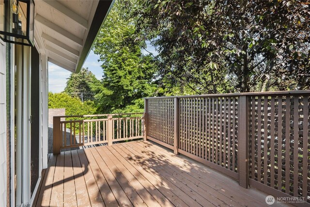3801 Ruddell Rd SE, Lacey, WA 98503 - wooden terrace with view of wooded area