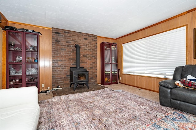 300 Brim Rd, Onalaska, WA 98570 - carpeted living area with wood walls, a wood stove, and baseboards