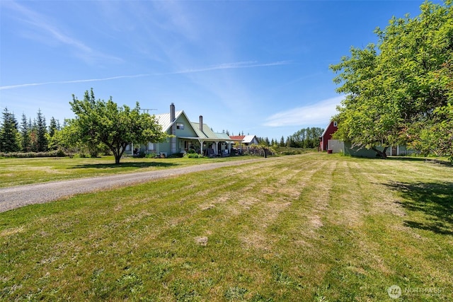 300 Brim Rd, Onalaska, WA 98570 - view of front of house featuring a front lawn, a chimney, and metal roof