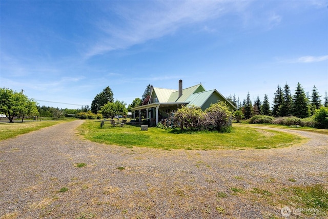300 Brim Rd, Onalaska, WA 98570 - view of property exterior featuring a chimney and metal roof