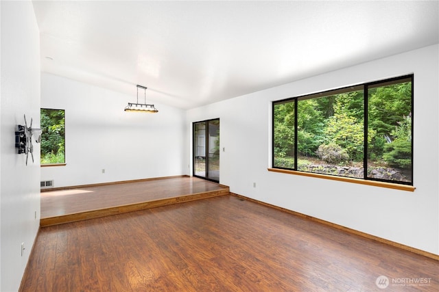 23611 Friar Creek Rd, Monroe, WA 98272 - spare room featuring lofted ceiling and wood finished floors