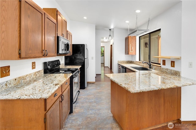23611 Friar Creek Rd, Monroe, WA 98272 - kitchen featuring stainless steel appliances, brown cabinetry, a peninsula, light stone countertops, and recessed lighting