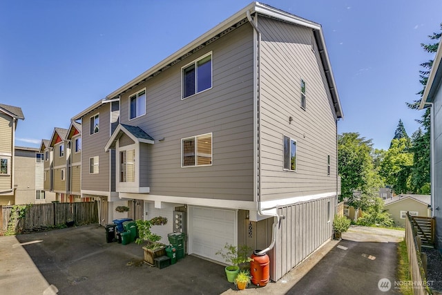 12046 33rd Ave NE Unit A, Seattle, WA 98125 - rear view of property featuring an attached garage