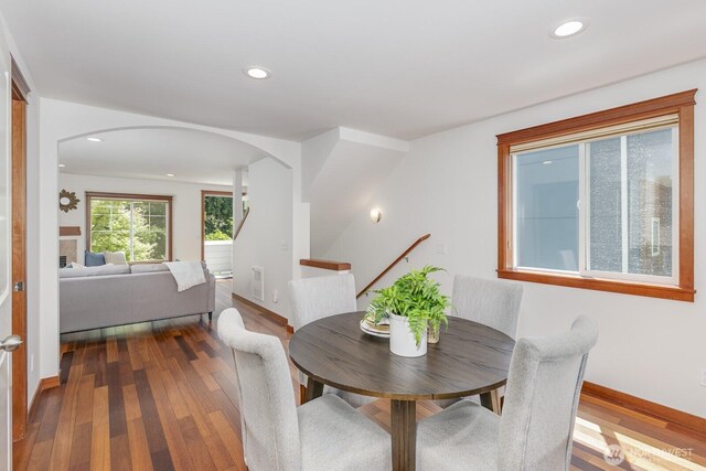 12046 33rd Ave NE Unit A, Seattle, WA 98125 - dining space with arched walkways, dark wood-type flooring, baseboards, and recessed lighting