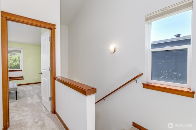 12046 33rd Ave NE Unit A, Seattle, WA 98125 - corridor with an upstairs landing, carpet, and baseboards