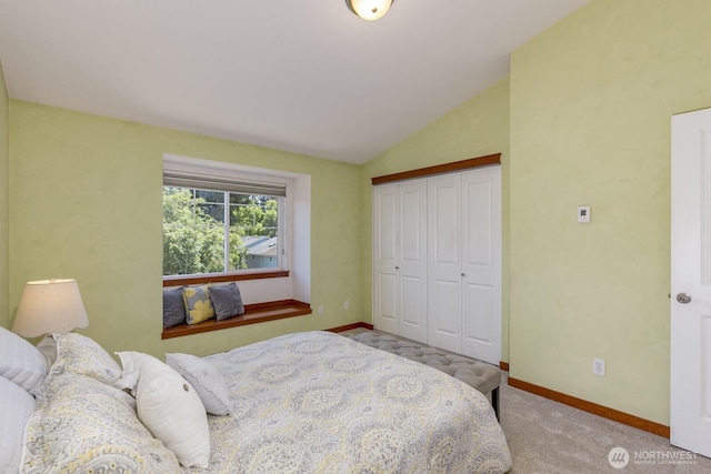 12046 33rd Ave NE Unit A, Seattle, WA 98125 - bedroom featuring baseboards, lofted ceiling, a closet, and carpet floors