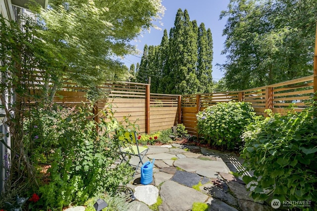 12046 33rd Ave NE Unit A, Seattle, WA 98125 - fenced backyard featuring a patio area