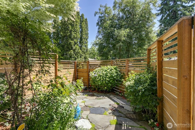 12046 33rd Ave NE Unit A, Seattle, WA 98125 - fenced backyard featuring a patio area