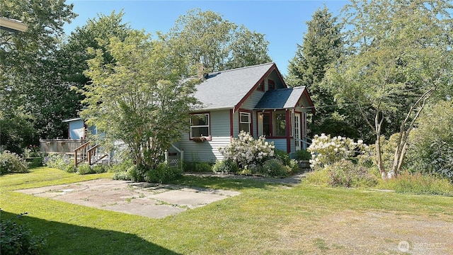 7459 Blaine Rd, Blaine, WA 98230 - view of front of property with roof with shingles, a front lawn, and a chimney