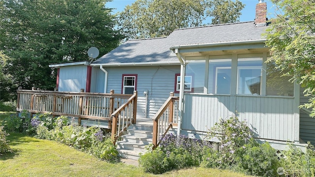 7459 Blaine Rd, Blaine, WA 98230 - rear view of property with a chimney and a wooden deck