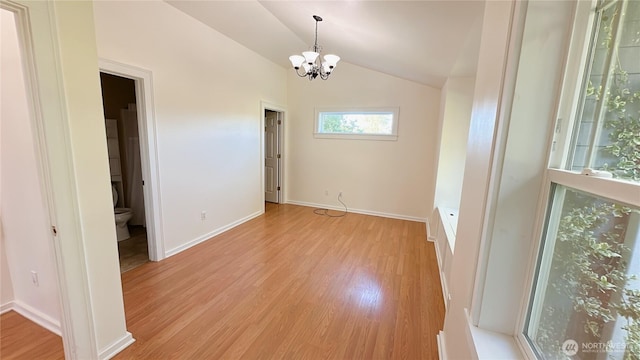 7459 Blaine Rd, Blaine, WA 98230 - spare room with a chandelier, light wood finished floors, lofted ceiling, and baseboards