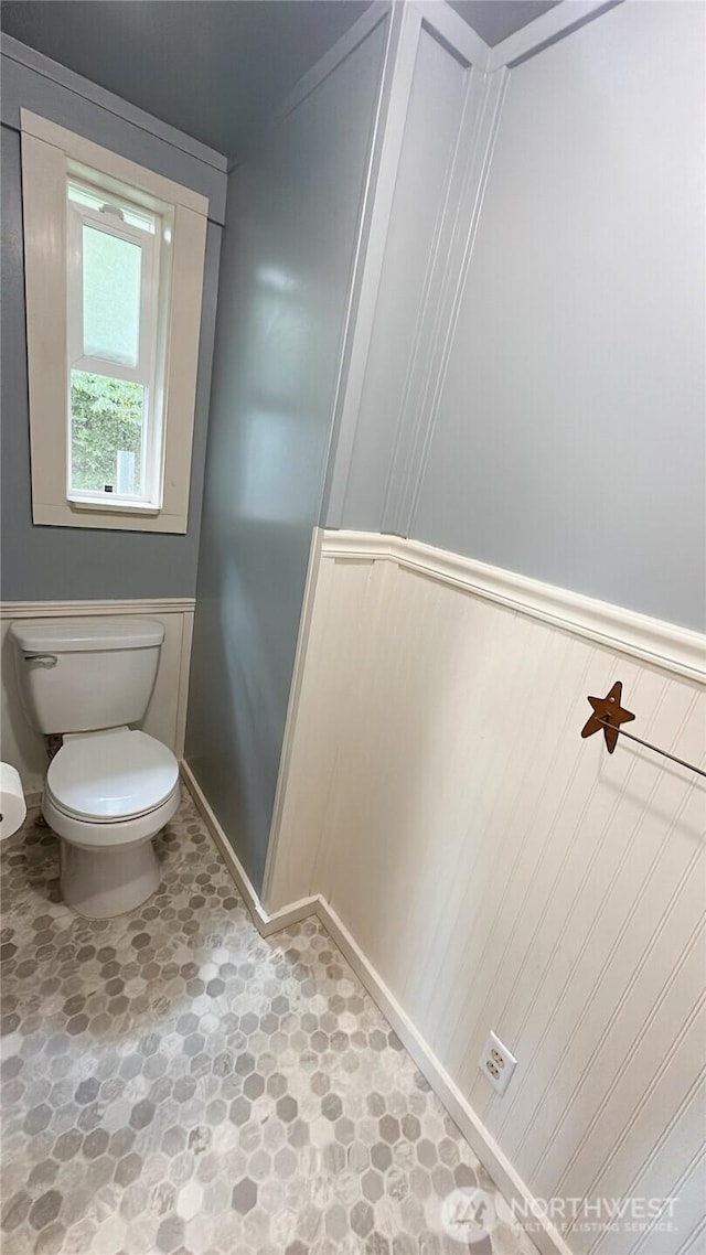 7459 Blaine Rd, Blaine, WA 98230 - bathroom with toilet, a wainscoted wall, and a decorative wall