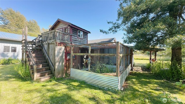 7459 Blaine Rd, Blaine, WA 98230 - rear view of house featuring a lawn, exterior structure, and stairs